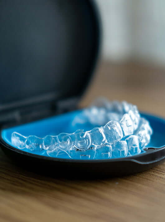 tray holding a set of Invisalign clear aligners