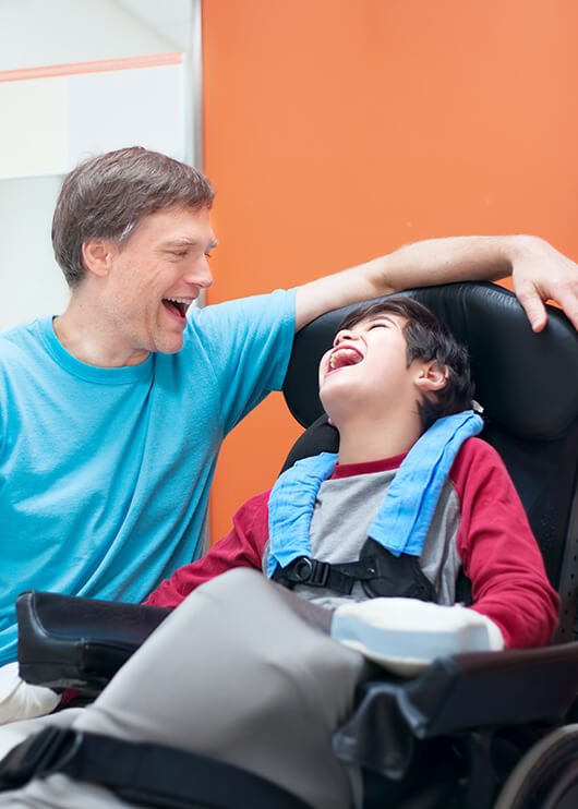 father and his wheelchair-bound son at the dentist's office