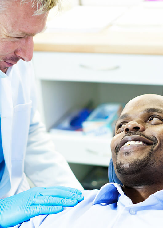 dentist comforting a patient