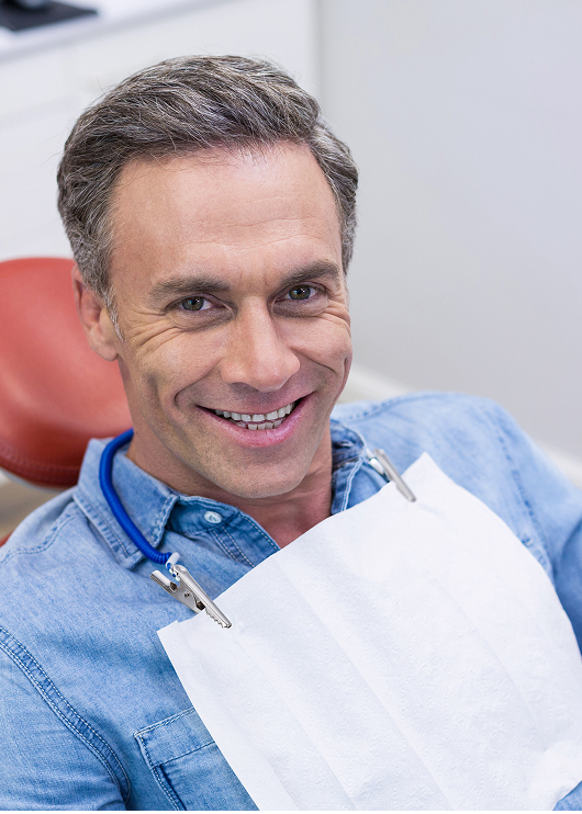 smiling man at the dentist