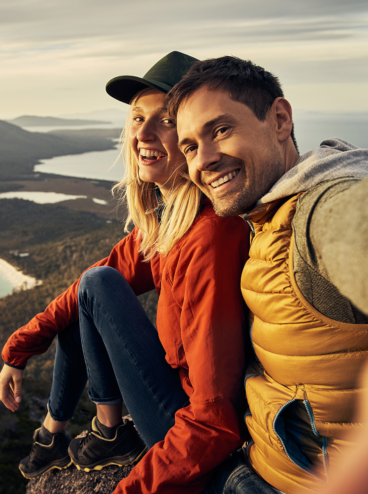 happy couple in front of great view