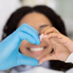 dentist and patient making a heart with their hands, blood thinner, high risk dentistry