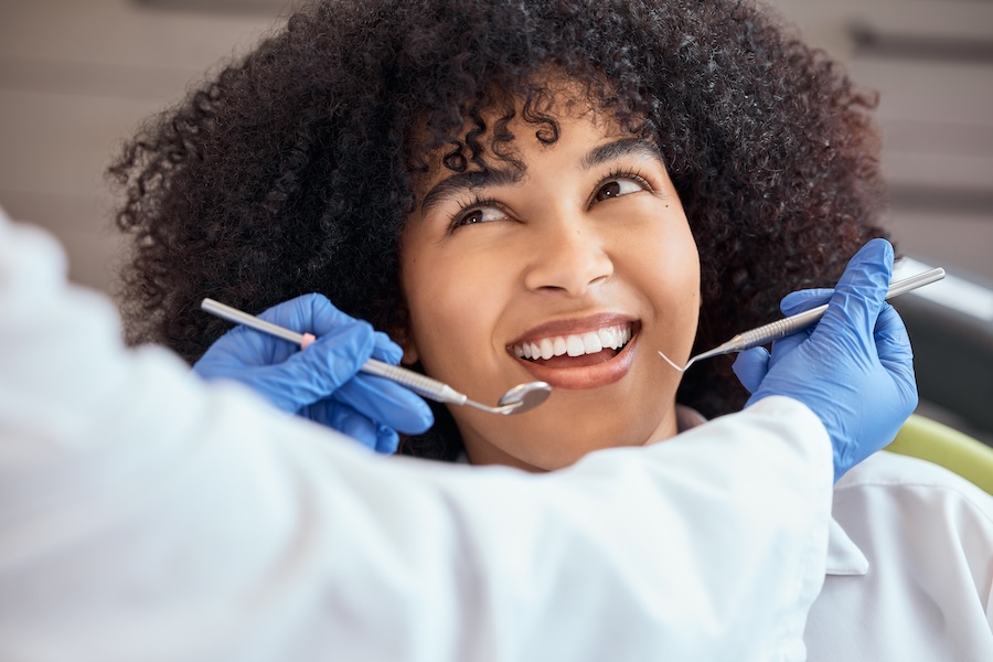 woman at a caring dentist near richardson